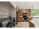 Efficient kitchen with stainless steel appliances, ample cabinets, and tile flooring at 2002 E 102Nd Cir, Thornton, CO 80229