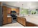 A view of the kitchen featuring stainless steel appliances and wooden cabinets at 2002 E 102Nd Cir, Thornton, CO 80229
