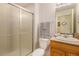 Well-maintained bathroom with a glass-enclosed shower, a sink, and neutral color scheme at 1153 Village Cir, Erie, CO 80516