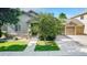 Craftsman home with manicured lawn and shade tree, featuring stone accents and a two-car attached garage at 1153 Village Cir, Erie, CO 80516