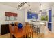 Cozy dining area leading into a lovely kitchen with pendant lighting and modern appliances at 1153 Village Cir, Erie, CO 80516
