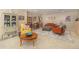 Spacious living room with carpet flooring, ample seating and decorative bookshelves at 1153 Village Cir, Erie, CO 80516