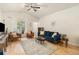 Spacious living area with lots of natural light, hardwood floors and comfy furniture at 1153 Village Cir, Erie, CO 80516