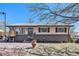 Charming single-story home with a brick foundation and well-maintained lawn at 8244 Clemson Ln, Westminster, CO 80031