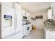 Functional kitchen featuring modern appliances, white cabinetry, and a breakfast bar perfect for quick meals at 8244 Clemson Ln, Westminster, CO 80031