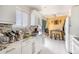 Bright kitchen equipped with granite countertops, modern appliances, and a tile backsplash that makes cooking enjoyable at 8244 Clemson Ln, Westminster, CO 80031