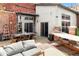 Beautiful backyard with an outdoor seating area, patio, and a hammock for relaxing at 3033 Blake St # 109, Denver, CO 80205
