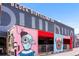Creative shipping container bar with colorful street art at Block Distilling Co. building at 3033 Blake St # 109, Denver, CO 80205