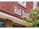 Rail Yard building exterior with a brick facade and white lettering against a blue sky at 3033 Blake St # 109, Denver, CO 80205