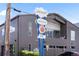 Contemporary gray mixed-use property with commercial signage and partial balcony at 3033 Blake St # 109, Denver, CO 80205