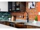 Modern kitchen boasting stainless steel appliances, granite countertops, and beautiful cabinetry at 3033 Blake St # 109, Denver, CO 80205