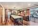 Open kitchen with large island, stainless steel appliances, and modern fixtures at 3033 Blake St # 109, Denver, CO 80205
