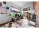 Bright living room featuring a large window, hardwood floors, and a cozy seating area at 3033 Blake St # 109, Denver, CO 80205
