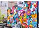 Colorful and whimsical street art mural adorning an exterior wall in Denver, CO at 3033 Blake St # 109, Denver, CO 80205