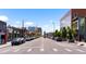 Lively Denver street with various businesses, cars, and buildings creating an energetic urban atmosphere at 3033 Blake St # 109, Denver, CO 80205