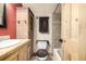 Rustic bathroom with wood vanity and tiled shower at 381 Lake Rd, Idaho Springs, CO 80452