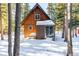 A-frame cabin exterior with snowy landscape at 381 Lake Rd, Idaho Springs, CO 80452