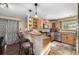 Kitchen with breakfast bar, wood cabinets, and stainless steel appliances at 381 Lake Rd, Idaho Springs, CO 80452