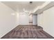Finished basement with neutral carpet and white walls at 6930 Warren Dr, Denver, CO 80221
