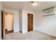 The room features neutral carpet, white walls, closet and window at 6930 Warren Dr, Denver, CO 80221