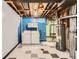 The laundry room features a washer, dryer, and water heater at 6930 Warren Dr, Denver, CO 80221