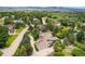Aerial view of property showcasing the lush landscaping and surrounding neighborhood with mountain views at 8337 Greenwood Dr, Niwot, CO 80503