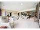 Large open basement layout with fireplace, sitting area, and access to upper level with stairs at 8337 Greenwood Dr, Niwot, CO 80503