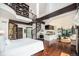 Spacious primary bedroom has a spiral staircase, fireplace, and seating area at 8337 Greenwood Dr, Niwot, CO 80503