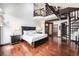 Expansive bedroom features a spiral staircase and great natural light at 8337 Greenwood Dr, Niwot, CO 80503