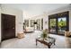 Bright bedroom with sitting area and glass doors leading to the backyard patio at 8337 Greenwood Dr, Niwot, CO 80503