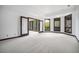 Spacious bonus room with plenty of natural light from large windows and access to balcony at 8337 Greenwood Dr, Niwot, CO 80503