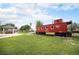 Historic red train caboose on display, offering a unique community attraction at 8337 Greenwood Dr, Niwot, CO 80503