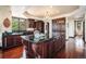 Spacious kitchen featuring custom cabinetry, granite countertops, and a large center island, creating a chef's dream space at 8337 Greenwood Dr, Niwot, CO 80503