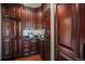 Spacious pantry with wood cabinetry and granite countertops provides ample storage at 8337 Greenwood Dr, Niwot, CO 80503