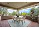 Relax on this covered patio with outdoor dining set and garden view at 8337 Greenwood Dr, Niwot, CO 80503