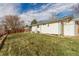 House exterior and expansive backyard with grassy lawn at 3460 W 131St Ave, Broomfield, CO 80020