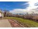 Spacious backyard with grassy area and a stone pathway at 3460 W 131St Ave, Broomfield, CO 80020