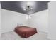 Basement bedroom with new carpet and a modern light fixture at 3460 W 131St Ave, Broomfield, CO 80020