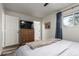 Bright bedroom with a dresser, large window and ceiling fan at 3460 W 131St Ave, Broomfield, CO 80020