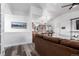 Bright living room with brown sectional sofa and wood floors at 3460 W 131St Ave, Broomfield, CO 80020