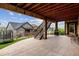 Backyard with a stamped concrete patio, outdoor grill, and view of the lawn and landscaping at 8107 Arapahoe Peak St, Littleton, CO 80125