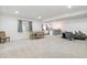 Finished basement featuring dining, living, and kitchenette space at 8107 Arapahoe Peak St, Littleton, CO 80125