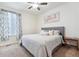Serene bedroom featuring a comfortable bed, soft carpet, and natural light at 8107 Arapahoe Peak St, Littleton, CO 80125