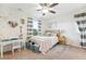 Charming bedroom with heart accents, a desk, and soft natural light at 8107 Arapahoe Peak St, Littleton, CO 80125