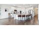 Modern kitchen featuring white cabinets, stainless steel appliances, and bar stool seating at 8107 Arapahoe Peak St, Littleton, CO 80125