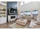 Inviting living area with fireplace, modern decor, and ample natural light at 8107 Arapahoe Peak St, Littleton, CO 80125