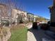 Spacious backyard with patio, seating, and meticulously designed landscaping elements at 5741 Echo Park Cir, Castle Rock, CO 80104
