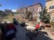 Inviting backyard patio area with comfortable seating, fire pit, and manicured landscaping at 5741 Echo Park Cir, Castle Rock, CO 80104