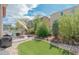 Landscaped backyard with patio, seating area, and manicured garden featuring lush plantings at 5741 Echo Park Cir, Castle Rock, CO 80104