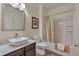 Bathroom featuring a sleek sink, modern fixtures, and a shower-tub combination at 5741 Echo Park Cir, Castle Rock, CO 80104